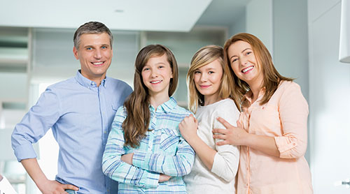 Happy family posing in a modern kitchen